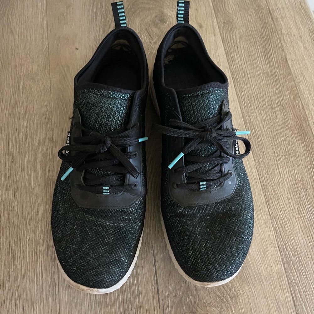 Teal and black Reebok sneakers